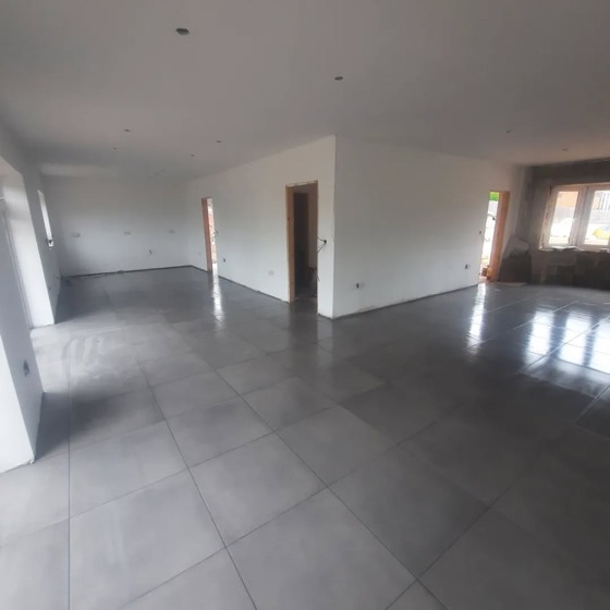 Grey porcelain floor tile running through an open plan ground floor